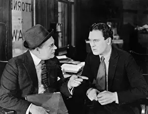 Fedora: Two businessmen interacting