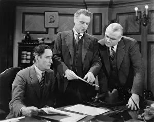 Coworkers: Businessmen reading a report