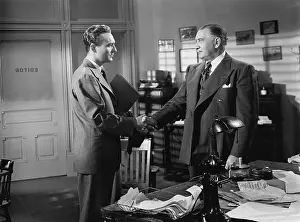 Executives: Two businessmen shaking hands