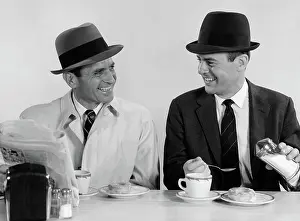Businesspeople: Two businessmen wearing hats drinking coffee
