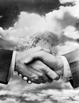 Businesspeople: Businessmen's hands in handshake superimposed