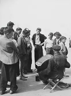 Busker: Busker with an accordion. About 1955