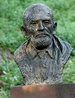 Xiiis: Bust statue of Theodore Monod seen at sunrise