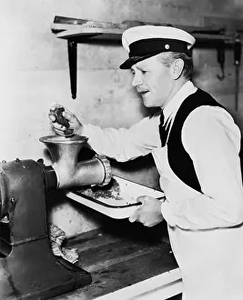 Employ: Butcher grinding meat