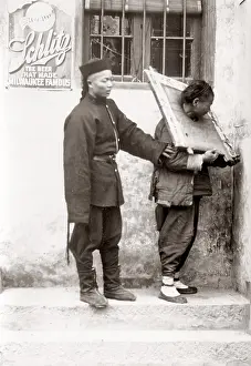 Stocks: c.1890 China - prisoner in cangue and guard