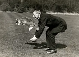 Leaping: c.1920's The butler and the leaping cat