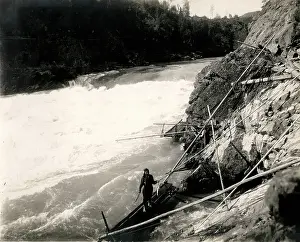 Raging: c.1920's fish traps on a raging river in Canada