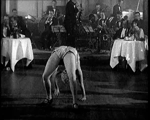 Patrons: A Cabaret Performer Dancing To Music Being