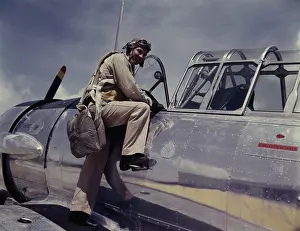 Cadet: Cadet posing by cockpit of plane at Naval