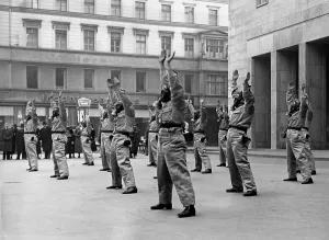Forecourt: Calisthenics in gas mask, 1937
