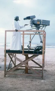 Salalah: Cameraman in Oman on wooden platform
