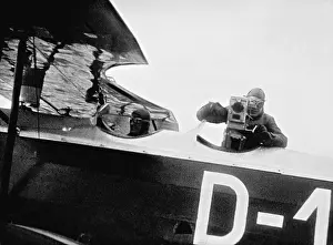 Newsreel: Cameraman during shooting from a plane