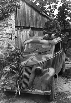 Overlord: Camouflaged German car in Normandy, 1944