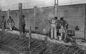 Prewar: Camp internees building the walls of Dachau concentration ca