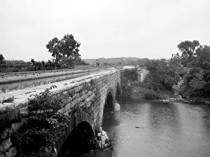 Aqueducts: Canal boat passing through an Aqueduct over ?