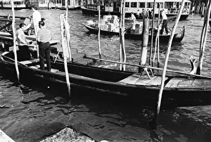 Gondolier: Canal in Venice with boats