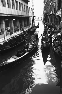 Gondoliers: Canal in Venice with gondolas