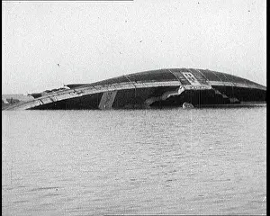 Capsized: A Capsized Italian Ship Being Righted