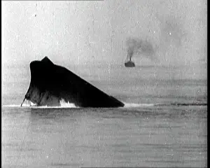 Capsized: A Capsized Ship Sinking Into the Sea
