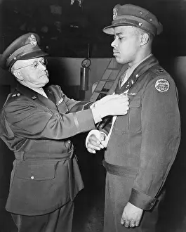 Posthumously: Capt. Charles L. Thomas, receives the Distinguished