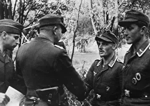 Honoring: Captain congratulates the commander of a paratroopers-sh