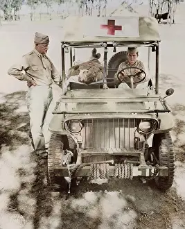 Stretcher: Captain Nelson inspecting a half-ton jeep