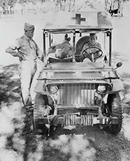 Ambulance: Captain Nelson inspecting a half-ton jeep