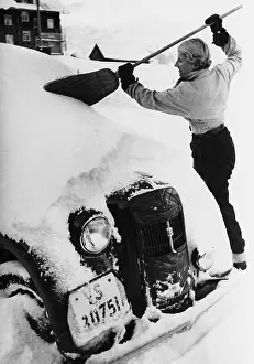 Broom: A car covered with snow in the winter, 1938
