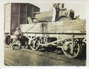 Sepia Images: Car being loaded onto a train, Middle East