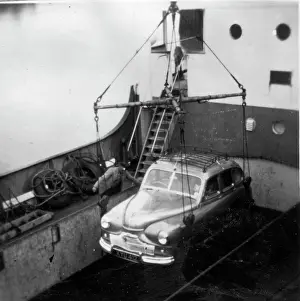 Lowering: Car lowered to deck of ferry