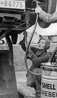 Absolute: Car mechanic at work, 1932
