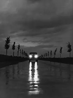 Headlights: Car on a rural road, 1938