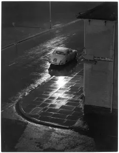 Lurks: Car on Wet Street