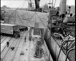 Unloaded: Cargo Being Unloaded by Crane From a Cargo Ship