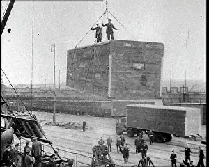 Unloaded: Cargo Being Unloaded by Crane From a Cargo Ship