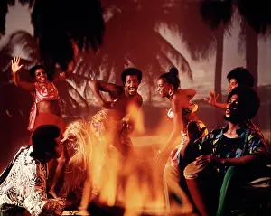 Caribbean Calypso Dancers and Musicians Around Fire