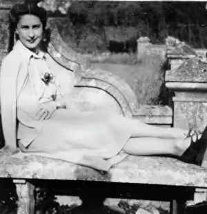 Carly: Carly sitting on stone bench