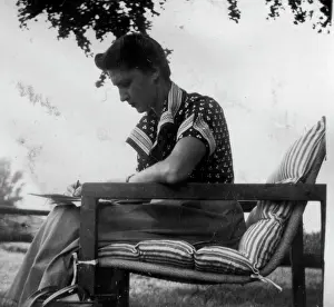 Carly sitting in a striped chair