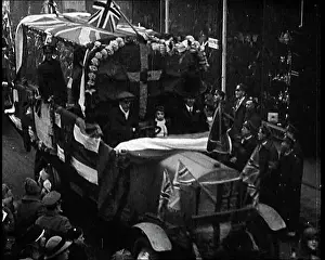 British Pathé Ltd: Carnival Procession Passing By A Crowd. There