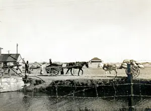 Sepia Images: Carts meeting on a bridge, Middle East