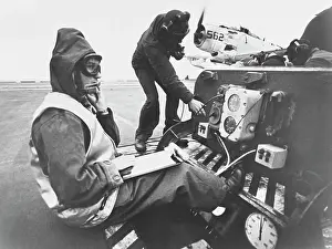 Catapult: A catapult officer at his station during flight