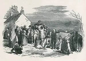 Separations: A Catholic priest blesses kneeling immigrants ?