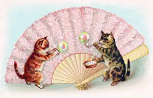 Feathery: Two cats blowing bubbles on a greetings postcard