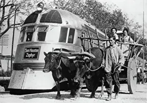 Zephyr: A cattle cart and a modern train on