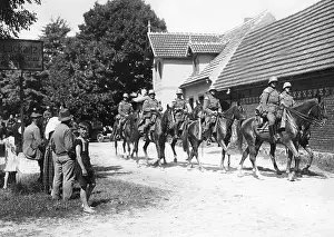 Kreis: Cavalry patrol passes through a village