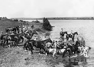 Observers: Cavalry of the Wehrmacht practices river crossing in the