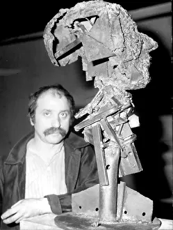 Decoratifs: Cesar Baldaccini with ironwork sculpture, Paris