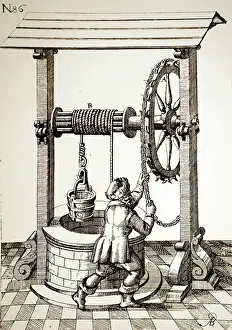 1620: CHAIN WHEEL being used to work the windlass on a well head