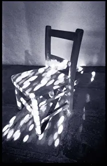 Dappled: Chair in dappled sunlight