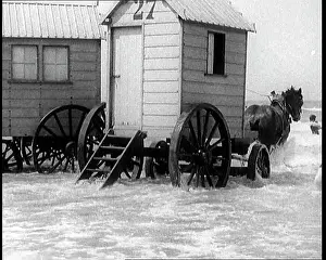 Cabins: Two Changing Cabins on Wheels Being Pulled